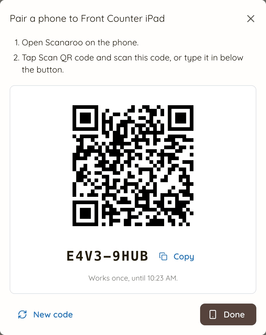 The Pair a phone dialog showing a QR code and an 8-character pairing code